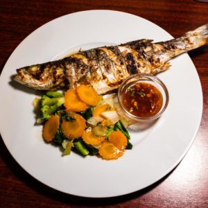 Grilled whole fish With chili-sauce and vegetables